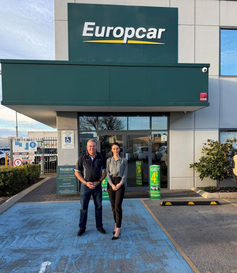 Ester and Tony Hume from Solaris Cancer Care stand outside Europcar/AUS Fleet Solutions.